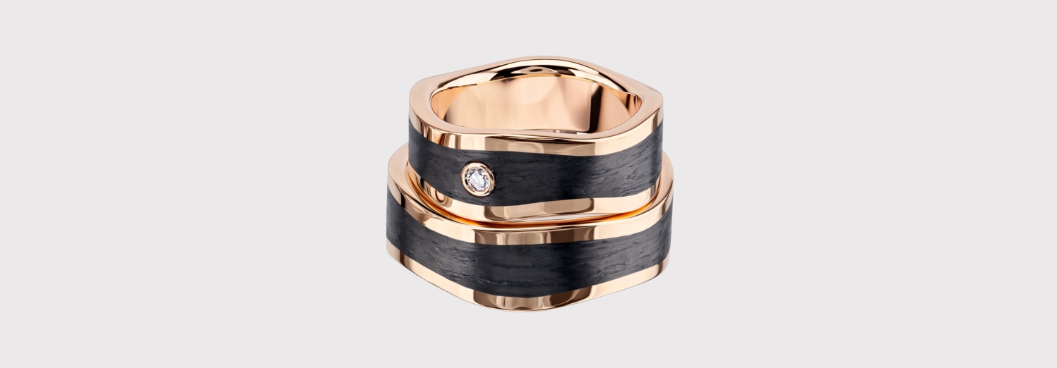 wedding bands in black and gold with diamonds